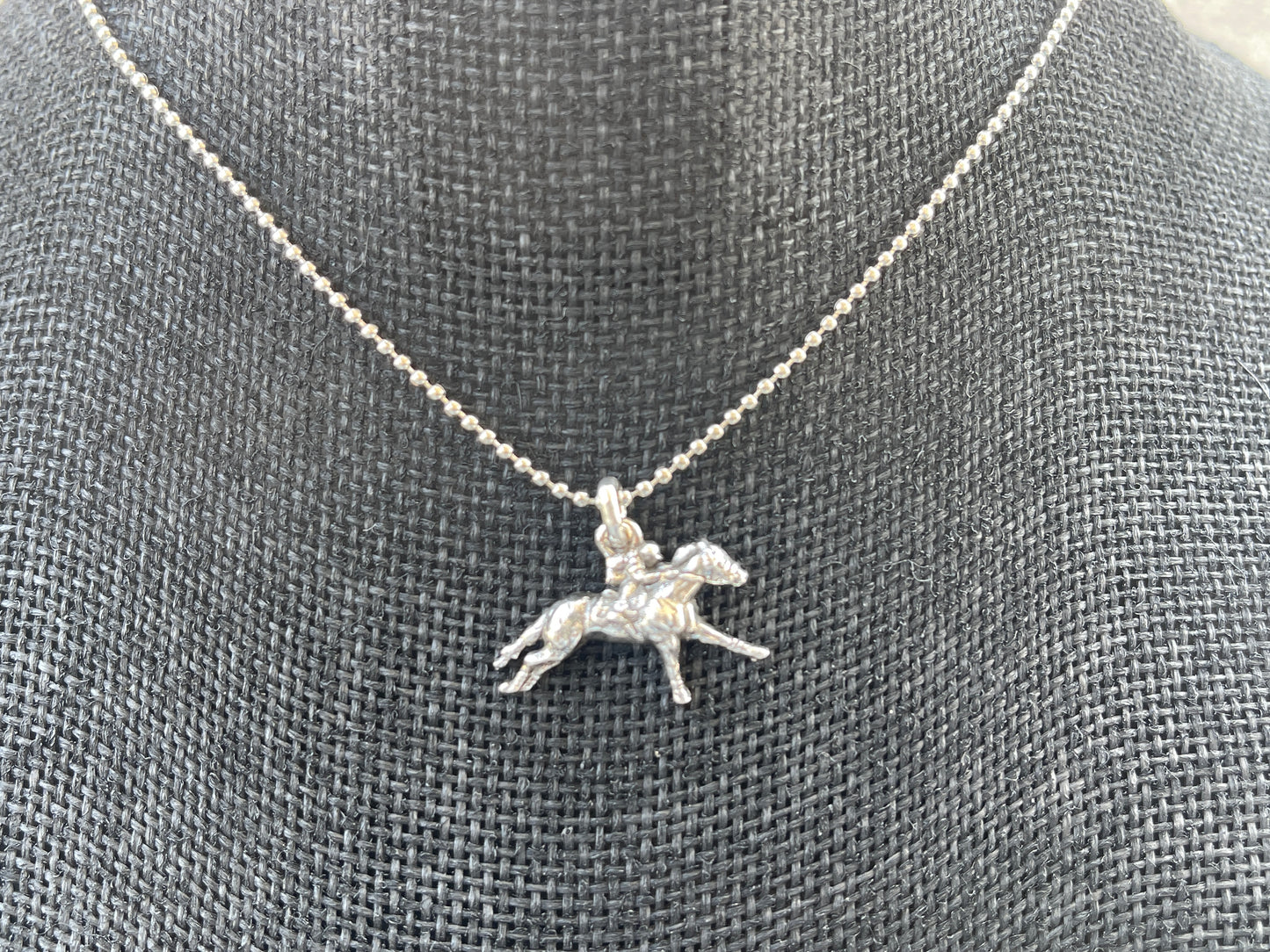 Racehorse (small)-  1 inch stretched out racehorse pendant, chain included.