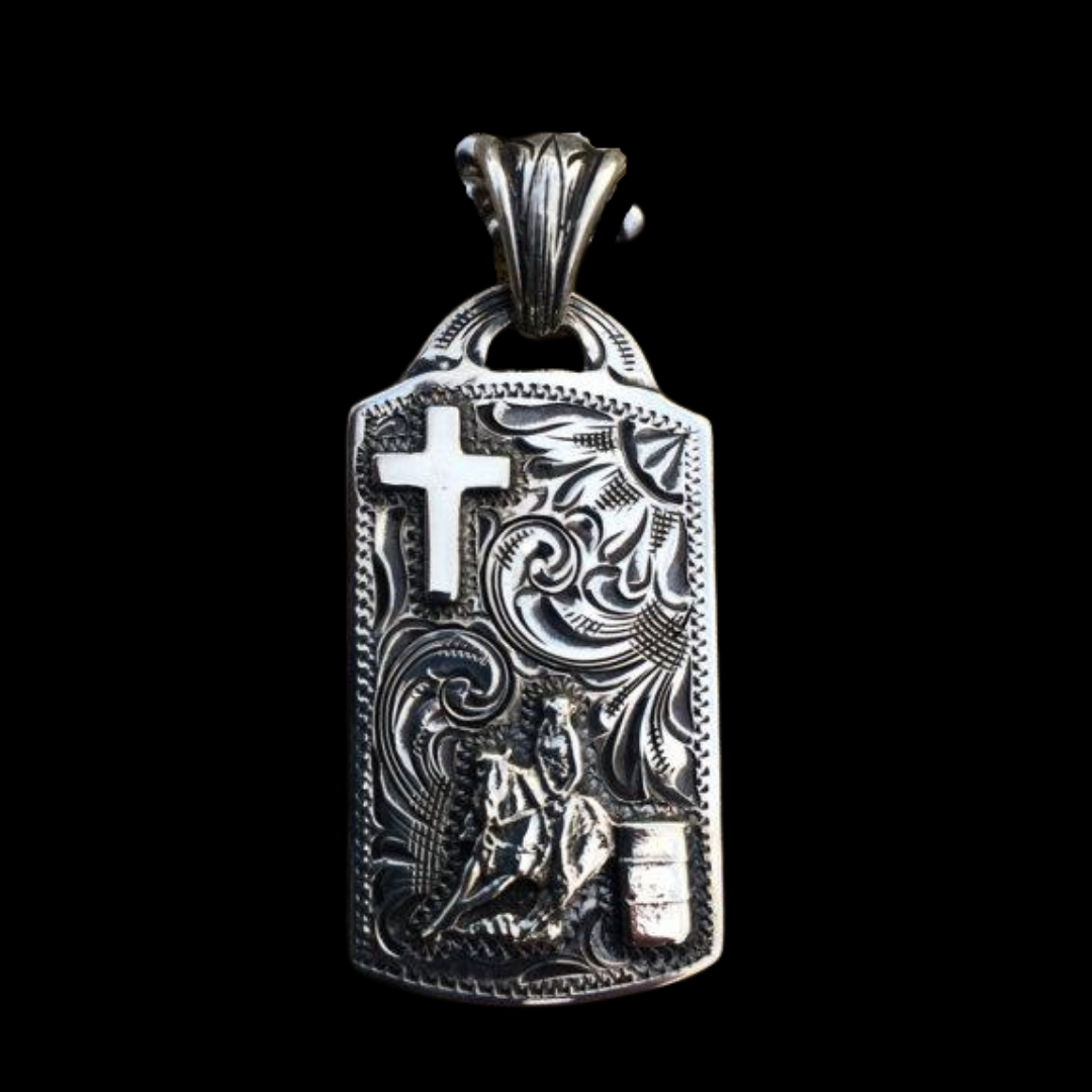 solid sterling silver dog tag shaped pendant is especially made for all of our Barrel Racers out there. The pendant features a very detailed barrel racing figure in the bottom right corner and a cross in the top left corner, with a western style hand engraved background.