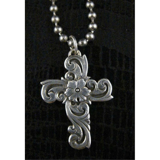 The "Hope" Pendant is a handmade solid sterling silver cross that features a western style hand engraving with a unique flower overlay. The pendant measures 1" long by 1 1/4" wide.