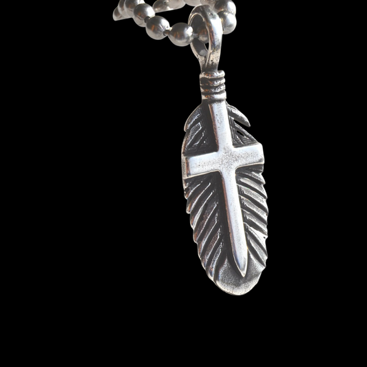 The "Feather of Faith" pendant is a custom feather shaped hand engraved pendant that features a cross in the center if the feather. Even the back of this stunning piece continues its beauty with an exquisite western style hand engraved scrolling to add the perfect touch to this piece of art.