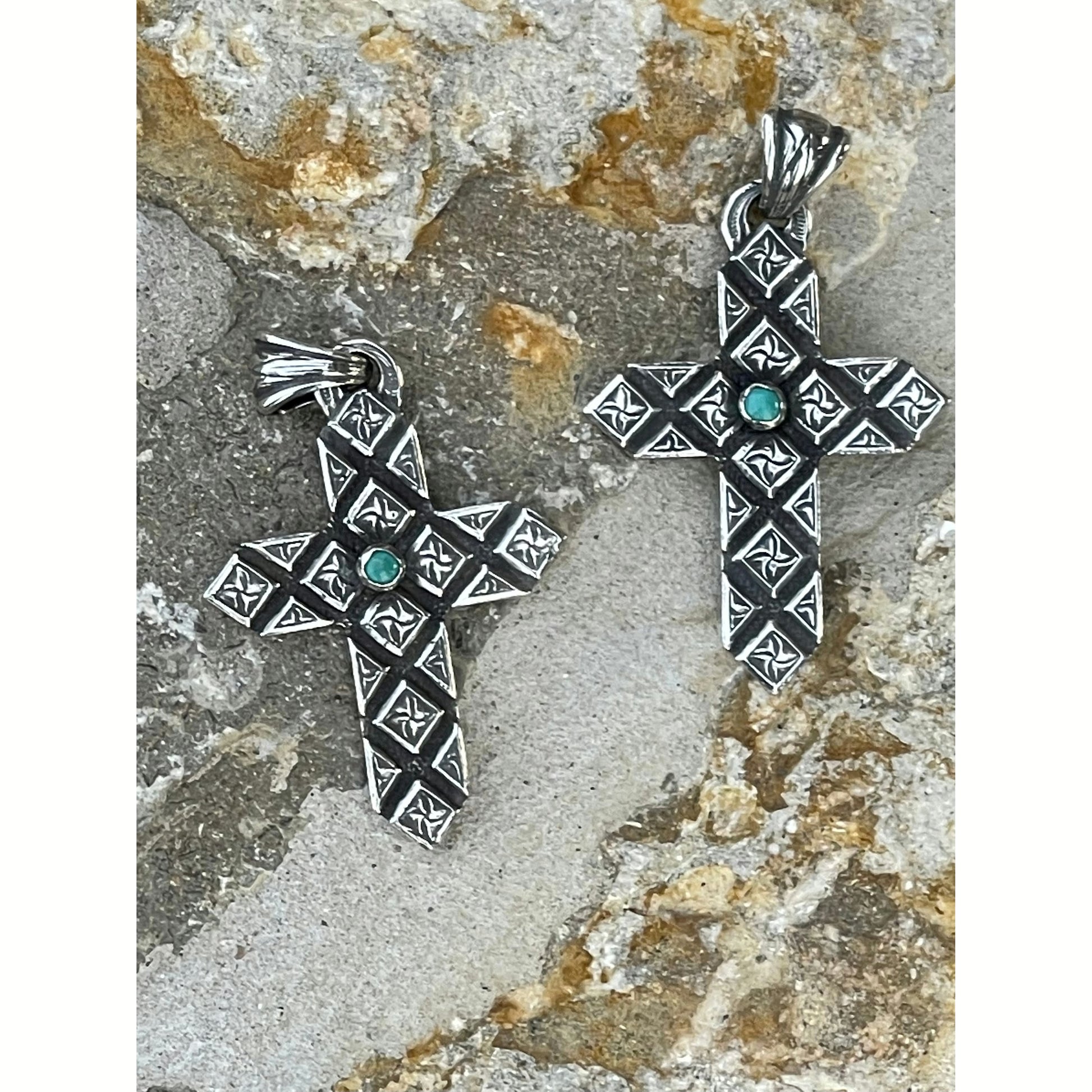 2”x1.5” Sterling Silver handmade diamond cross pendant with small round Kingman turquoise stone set in the middle of the cross finished with a beautiful antiquing. Pendant comes on a 24” wheat chain. 