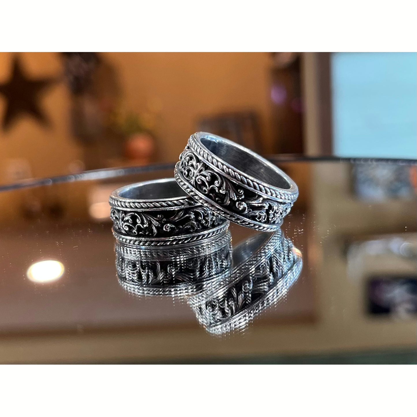 This custom band shows Justin's craftsmanship through the Victorian scrollwork on this sterling silver band finished off with a beautiful antiquing.