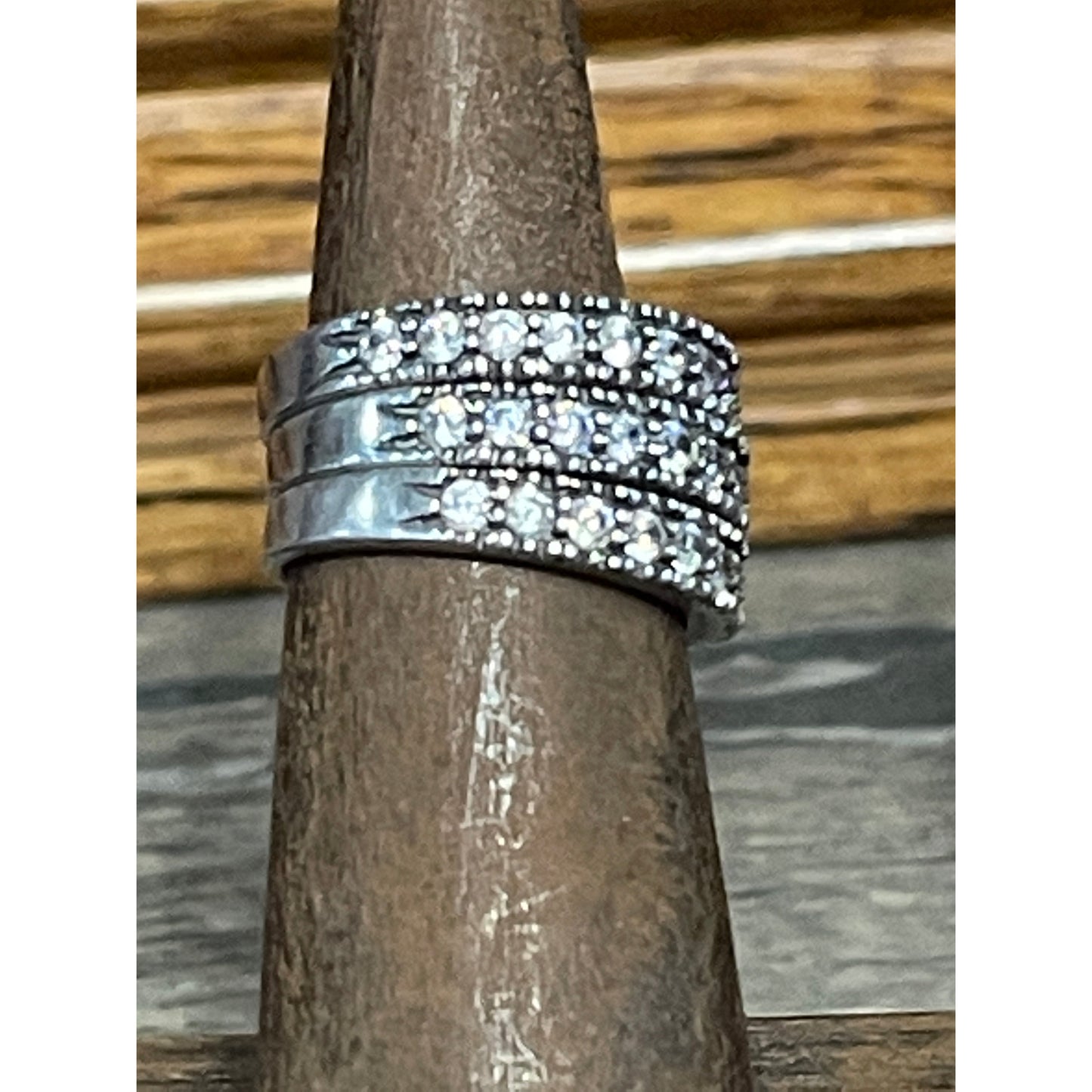 Our Juliet band is a gorgeous sterling silver band wrapped in beautiful cubic zirconia stones along the top of band. 